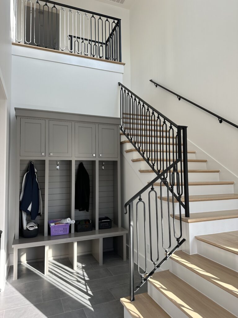 Painted built-in cabinets and staircase storage in Fort Worth home